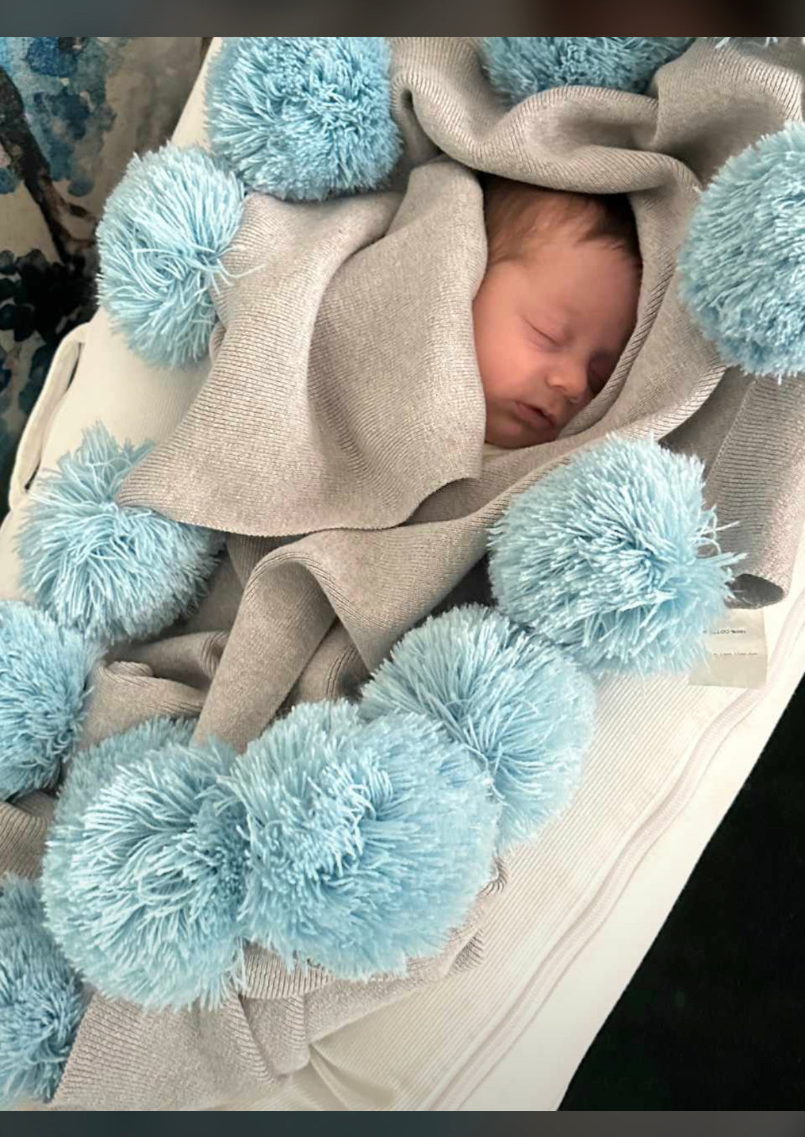 Blue pom pom blanket