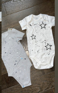 Blue ribbed splatter paint onesie