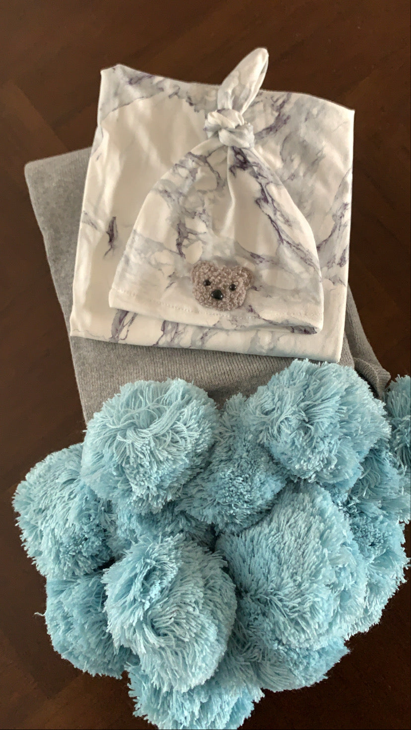 Blue pom pom blanket
