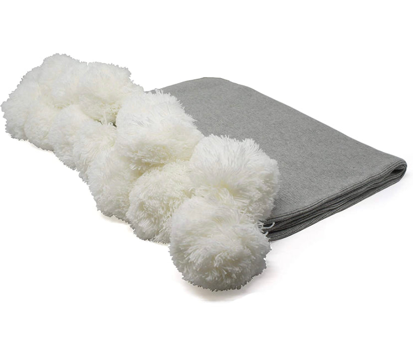 Gray pom pom blanket