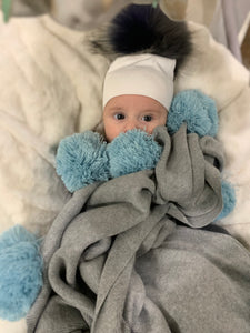 Blue pom pom blanket