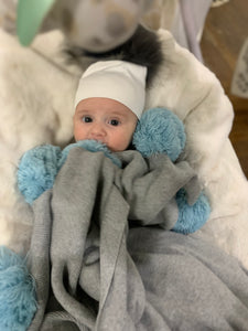 Blue pom pom blanket